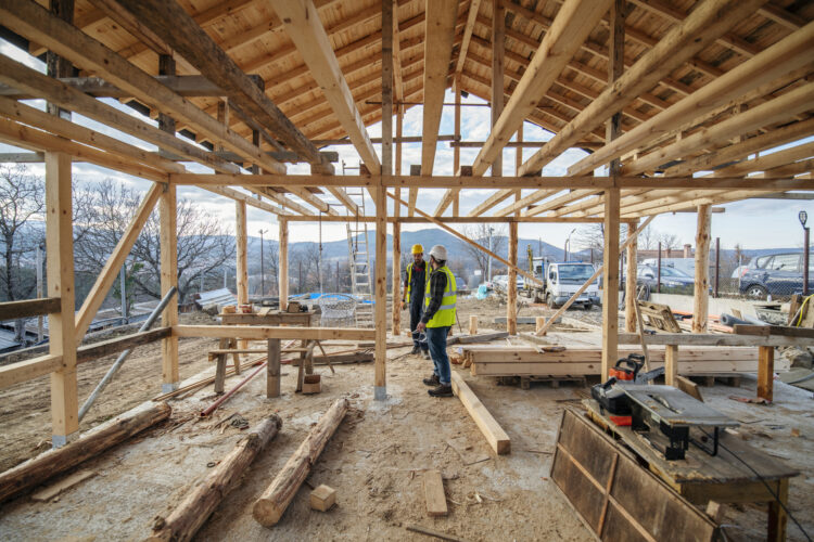 Construction workers building a wood frame structure