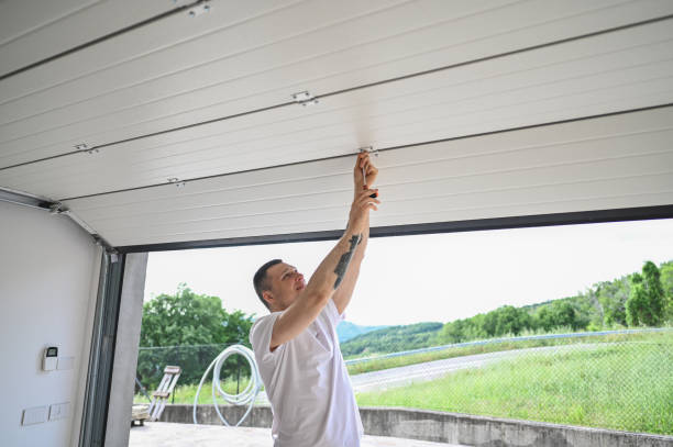 Professional installing and adjusting bi-fold hangar door panel