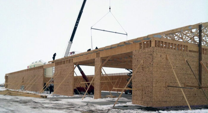 Construction of a durable hay barn featuring wooden frames and modern design