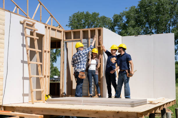 Team of builders collaborating during modular home construction