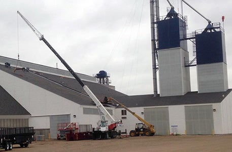 Steel building with cranes used for construction and equipment installation