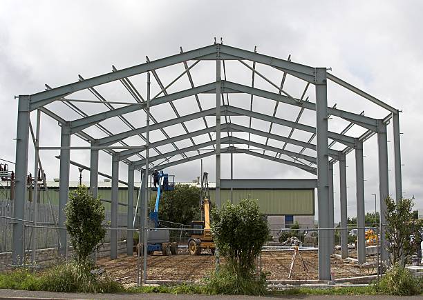 Steel structure framework with cranes at a construction site