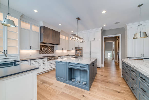 Spacious kitchen addition with large island and light fixtures