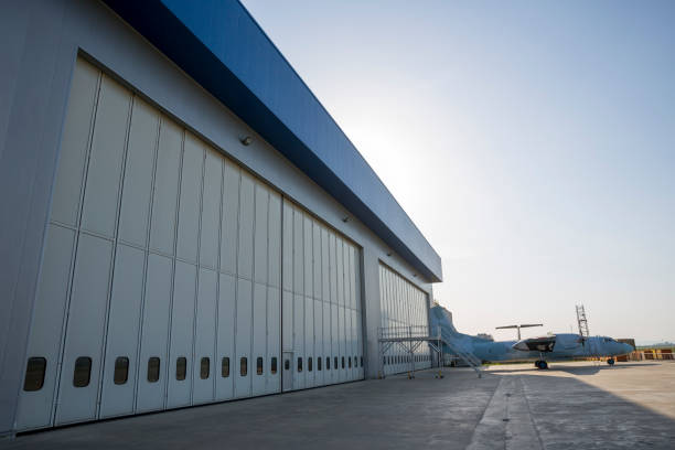 Completed hangar door installation with an aircraft outside