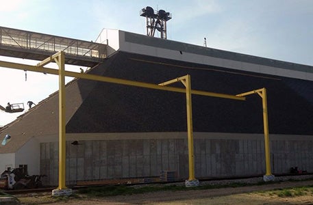 Steel framing installation in progress on large building facility