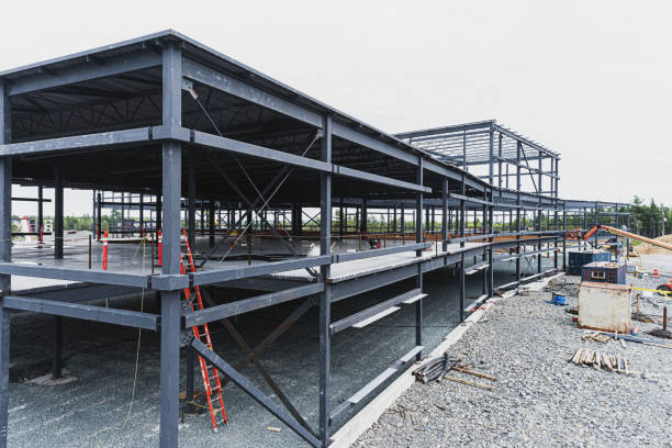 Hybrid steel building under construction with exposed metal frame