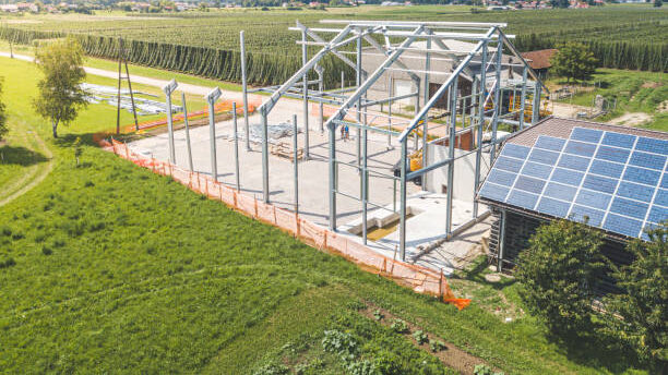 Metal frame structure for an agricultural building in progress