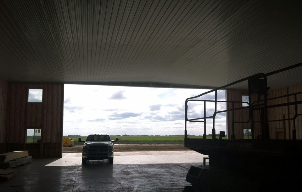 Interior view of a garage addition with ongoing construction work