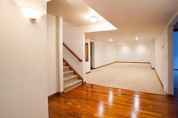 Completed basement with hardwood and carpet flooring installed