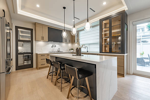 Modern kitchen with newly installed marble countertops and island
