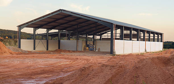 Modern livestock barn with open sides and space for cattle inside