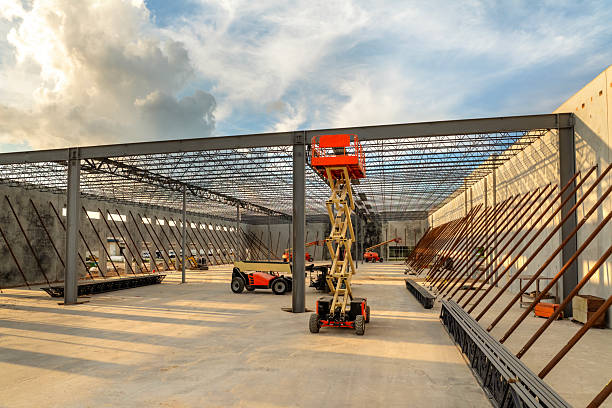 Interior steel support installation underway for aviation hangar construction