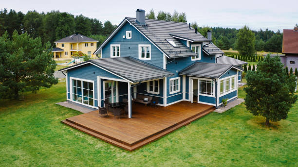 Newly constructed custom home featuring a large deck in the backyard