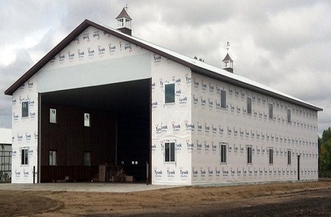 Newly built pole barn wrapped in Tyvek awaiting exterior finishes